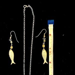 Unique silver necklace with matching earrings.